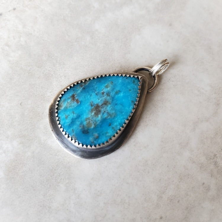 Arizona turquoise silversmith pendant only on tile
