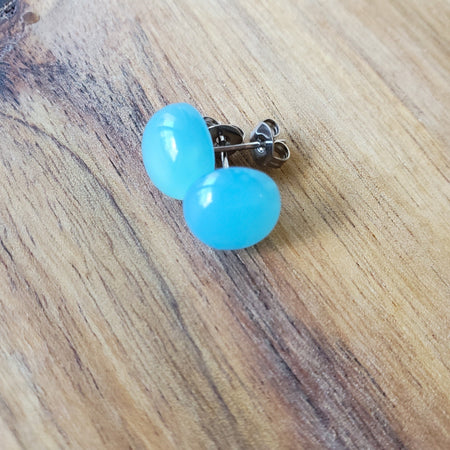 blue chalcedony stud earrings on wood