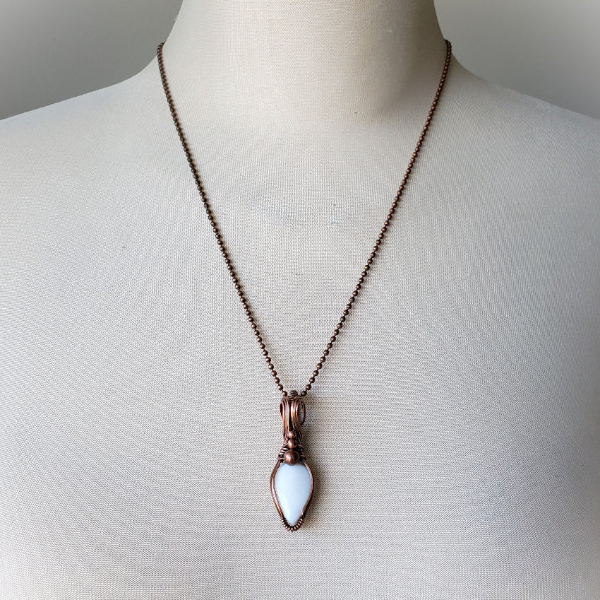 White Opal copper wire wrap pendant on a bust
