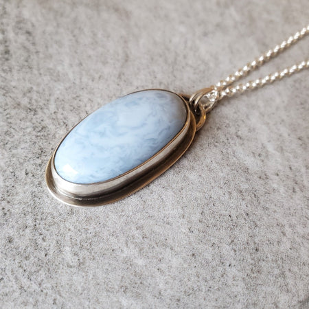 Blue Opal oval pendant set in silver