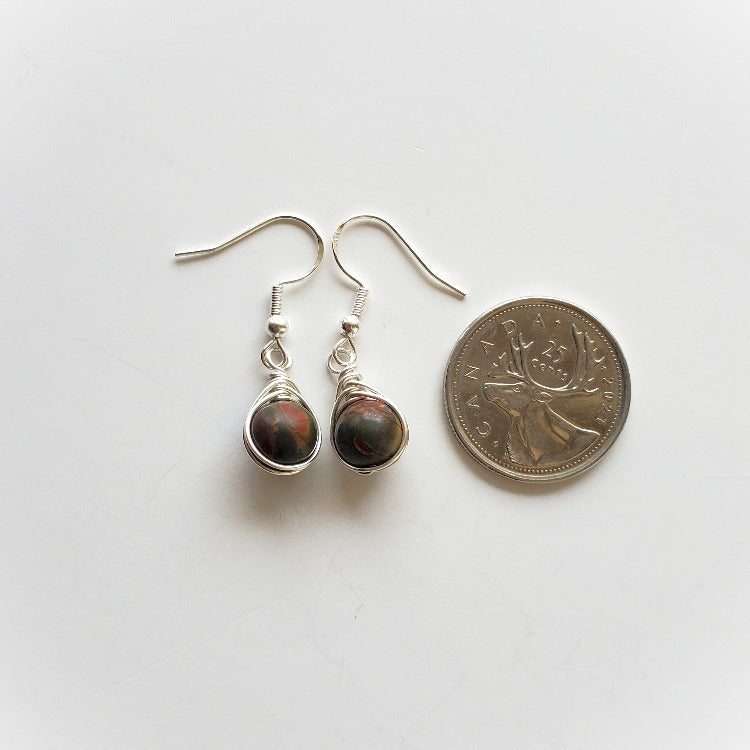 Picasso Jasper herringbone wrap earrings beside a quarter