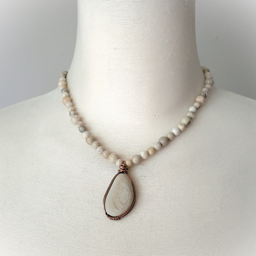 Beach rock focal stone with Fossil Coral necklace on bust