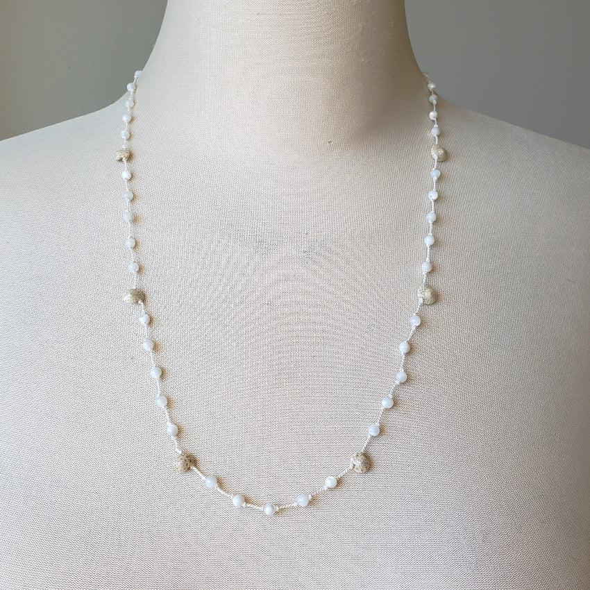 Mother of pearl and shell hand knotted necklace on bust