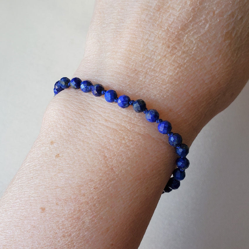 Faceted Sodalite hand knotted bracelet on model