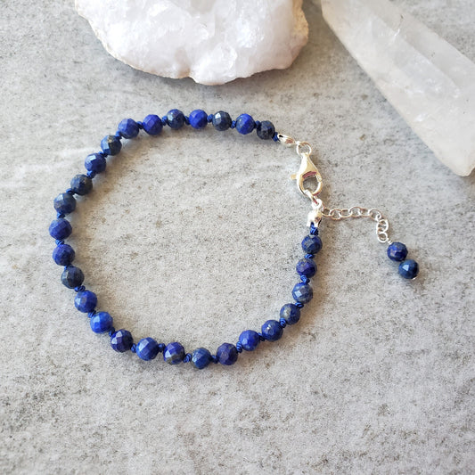 Lapis Lazuli faceted hand knotted bracelet on tile