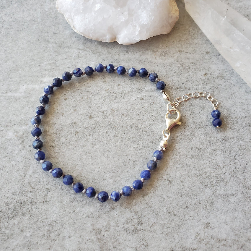Faceted Sodalite hand knotted bracelet on tile