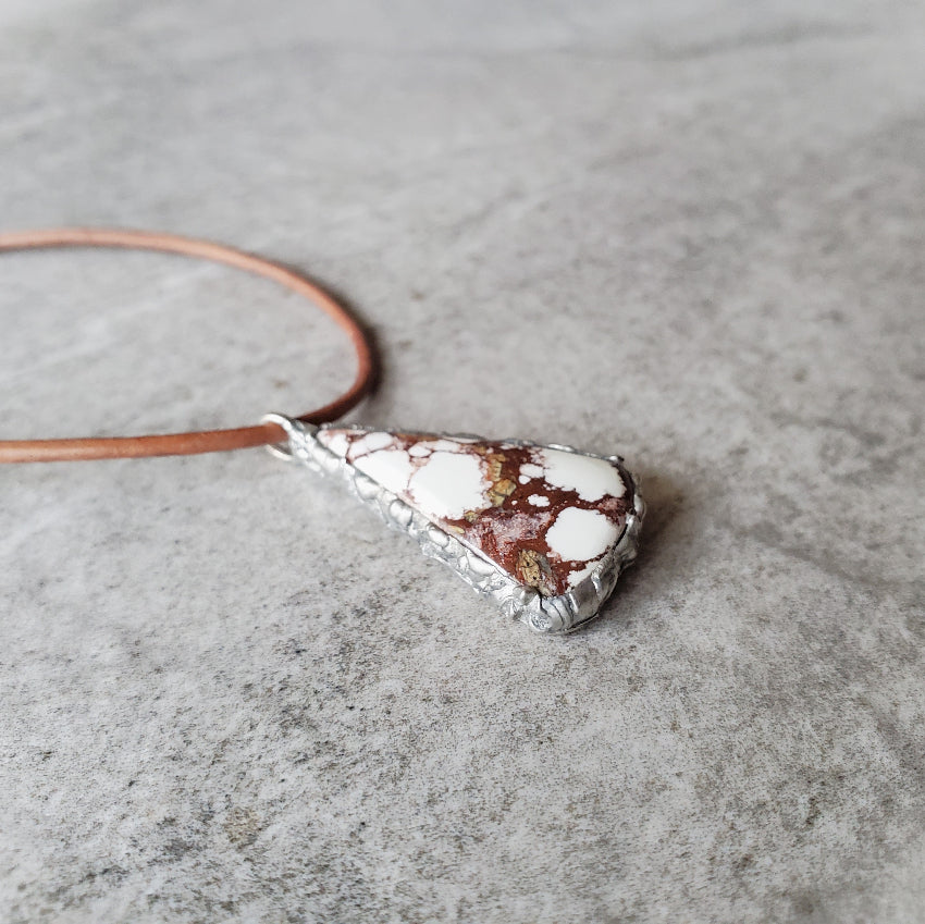Wild Horse magnesite necklace angle view on tile