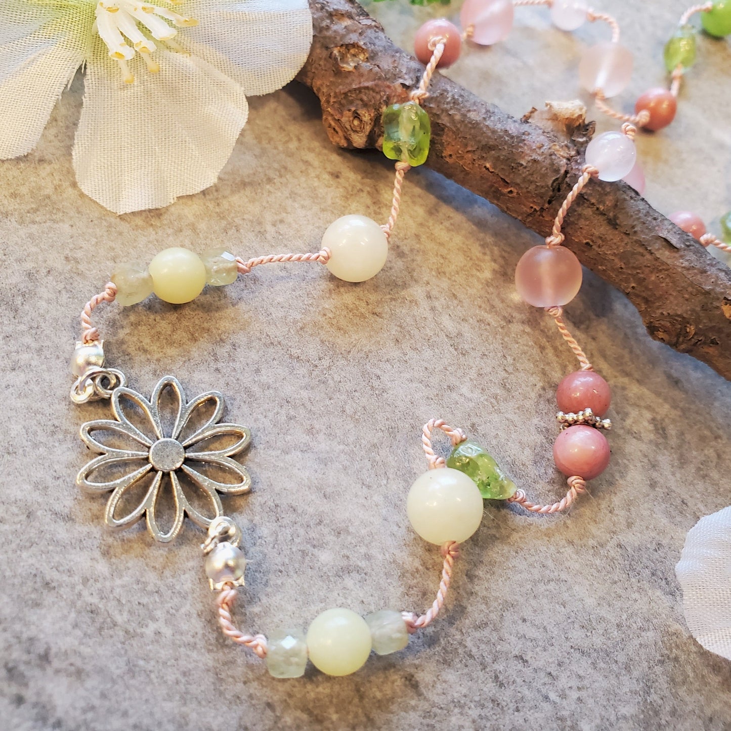 Colourful silk knotted necklace with multi gemstones and a flower connector.
