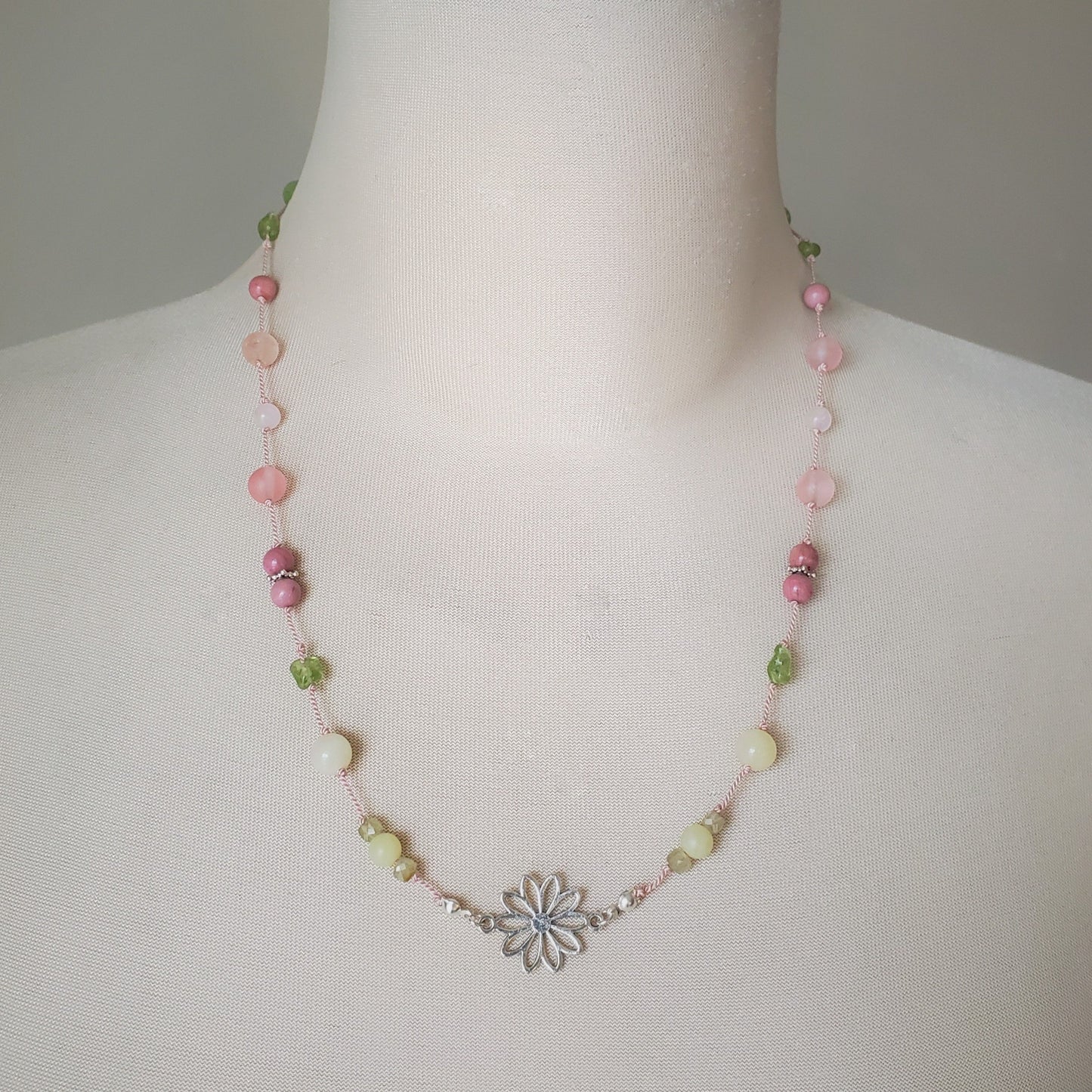 Colourful silk knotted necklace with multi gemstones and a flower connector.