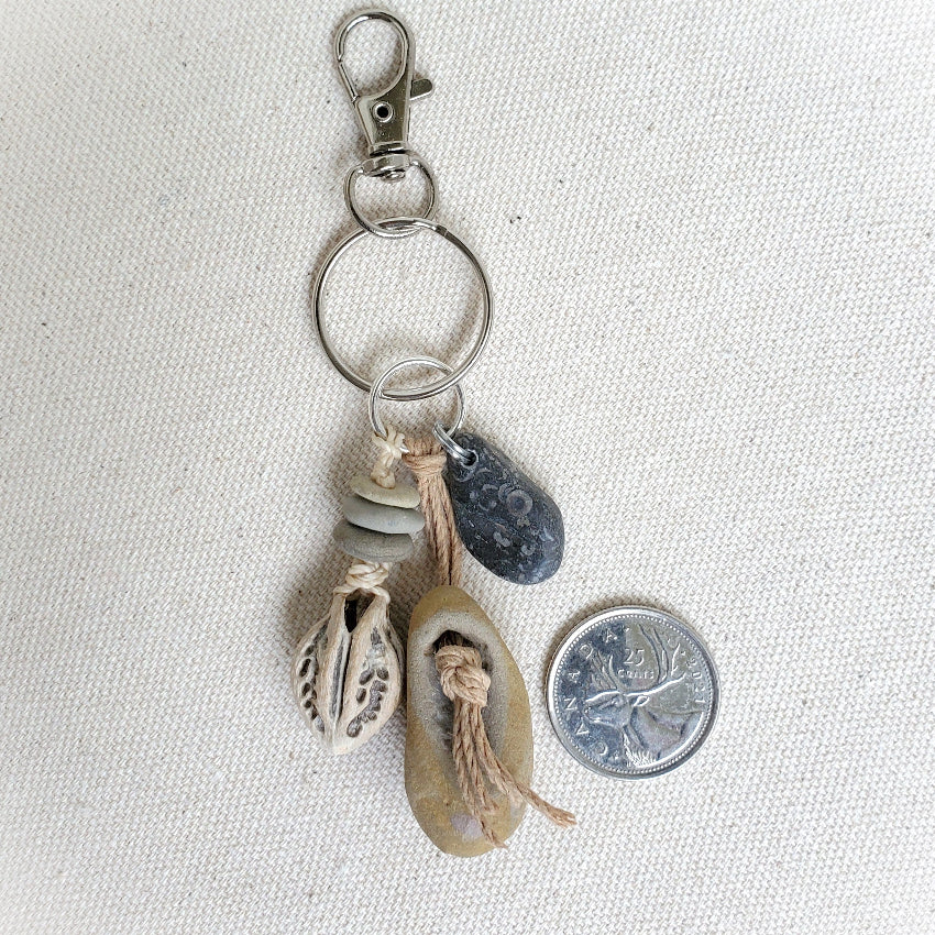 Keychain with natural elements on a light fabric background