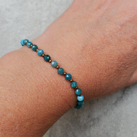 Diamond cut faceted Blue Apatite bracelet with copper accents on model