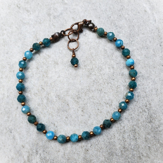 Diamond cut faceted Blue Apatite bracelet with copper accents on tile