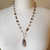 Multi gemstone knotted necklace on bust