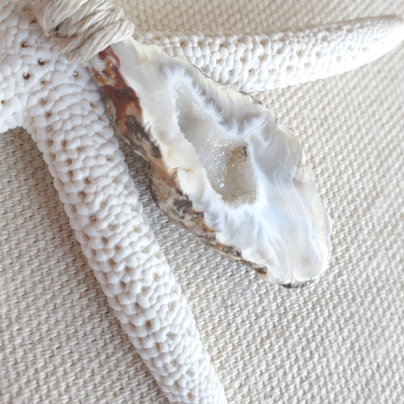 Close-up of a Druzy Agate on a textured beige surface