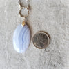 Blue Lace Agate focal beside a quarter