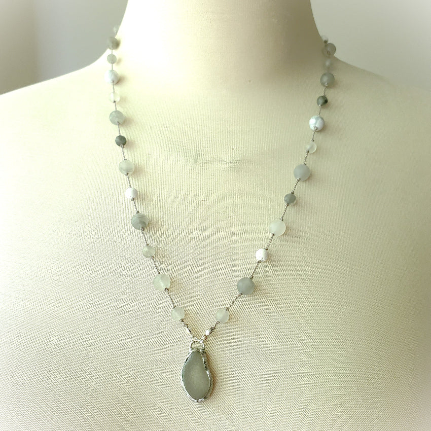 Necklace with grey beach glass on a mannequin