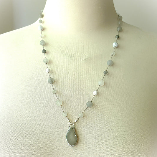Necklace with grey beach glass on a mannequin