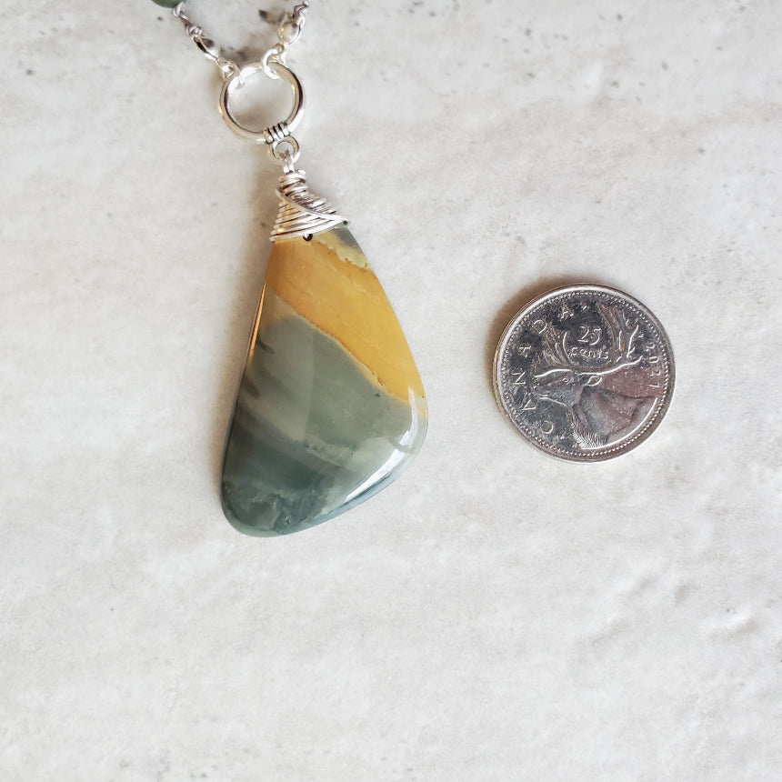 Ohywee Jasper focal beside a quarter