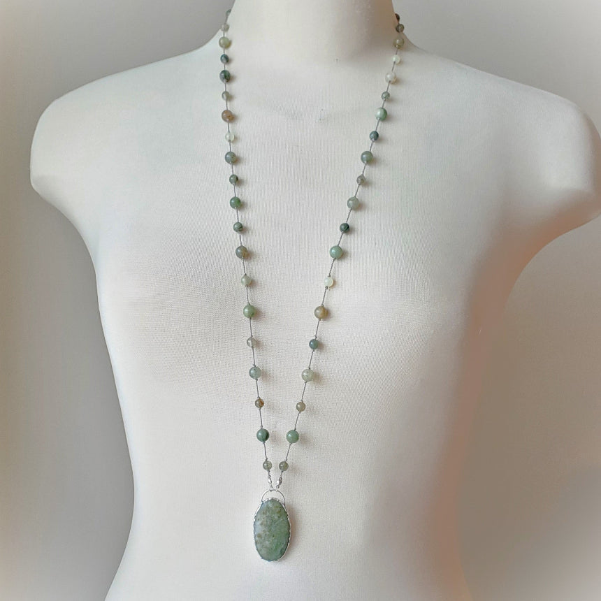 Beaded gemstone necklace on bust