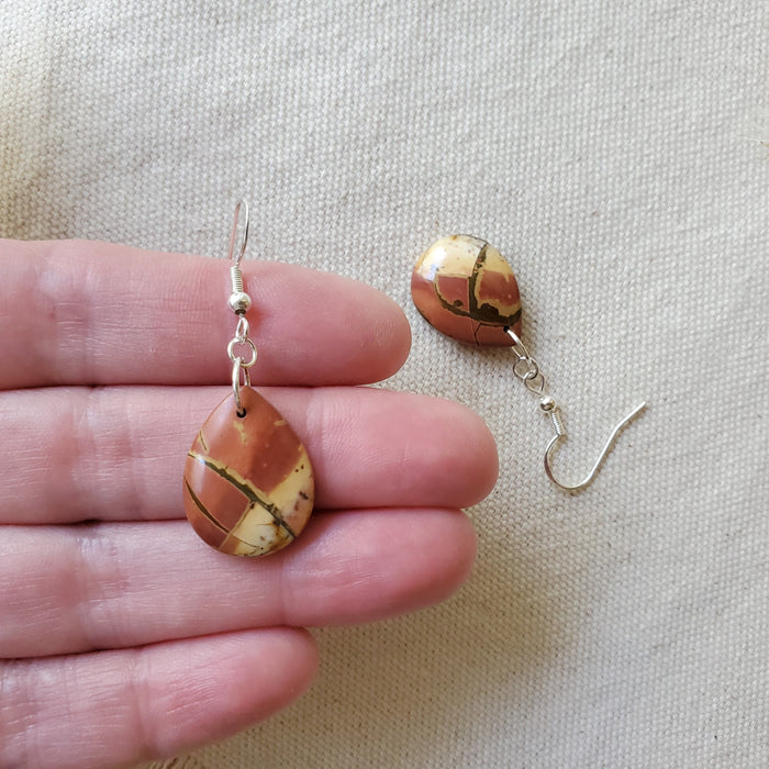 Picasso Jasper teardrop earrings in hand