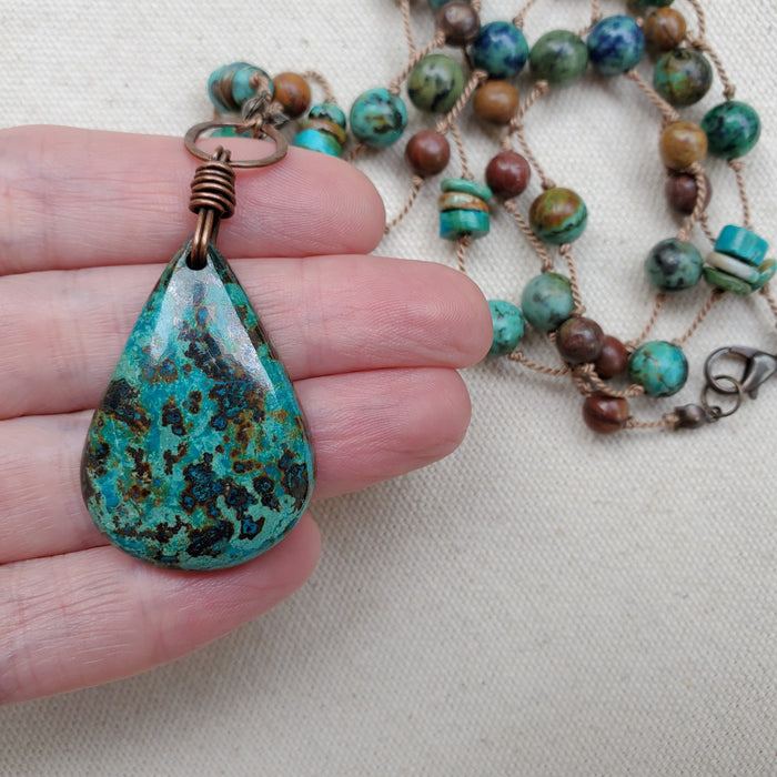 Hand knotted silk with gemstones in hand