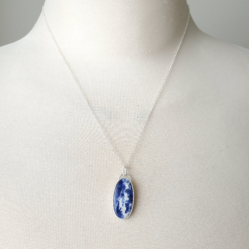 Sodalite silversmith pendant on bust 