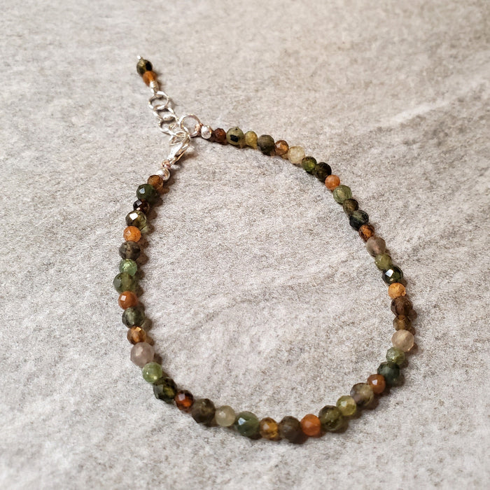 Faceted Tourmaline clasp bracelet on tile