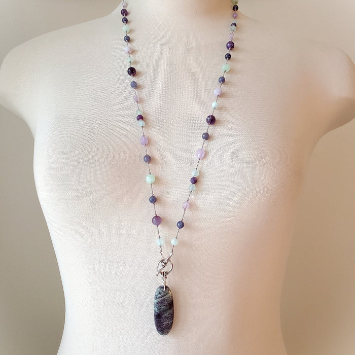 Purple and Green gemstone knotted necklace on bust