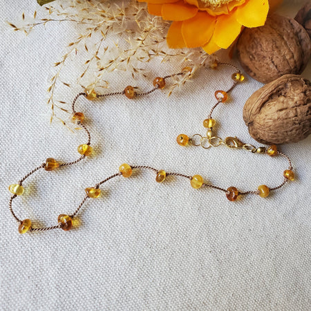 Genuine Baltic amber  hand knotted necklace on linen