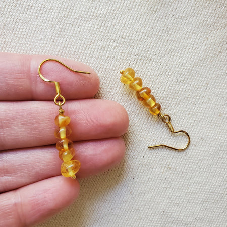 Baltic amber nugget stack earrings in hand