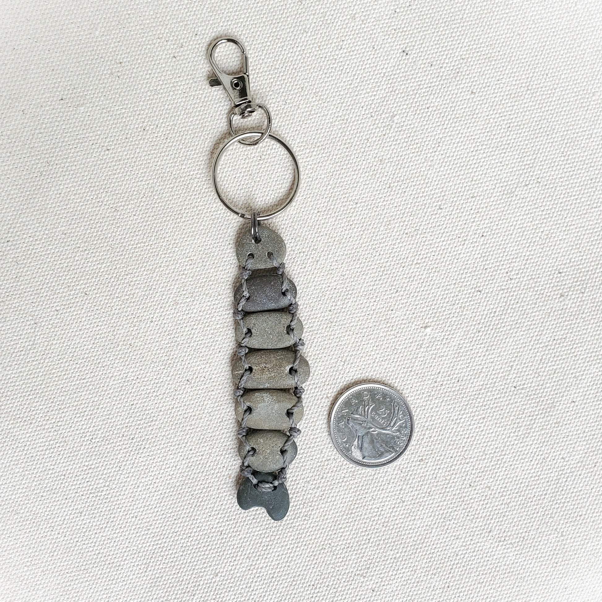 Keychain with a fish design on a light gray background