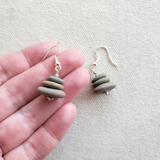 Beach rock stack earrings in hand