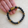 Black lava & Tiger's eye stretch bracelet on linen