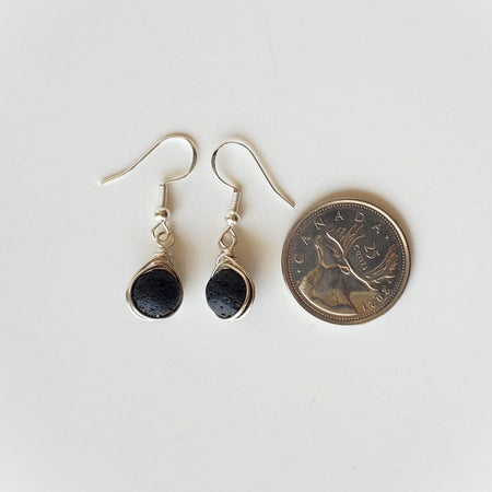 Black Lava herringbone wrapped earrings beside a quarter