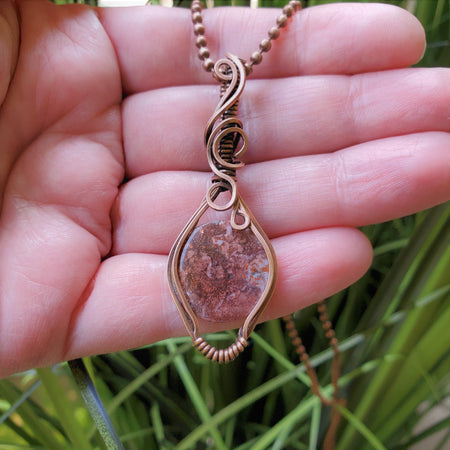 Wire Wrapped Pendant of petrified wood in raw copper