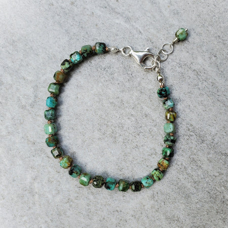 Faceted African turquoise bracelet on tile 