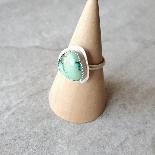 Tibetan Turquoise silversmith ring on wood stand