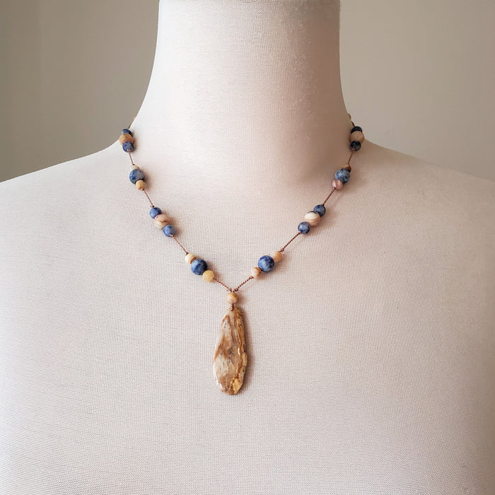 Hand Knotted gemstone Necklace in tan and blue on bust