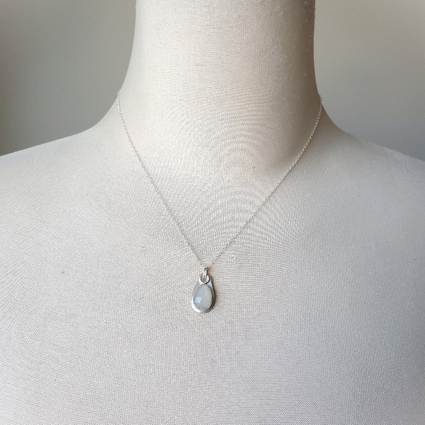 faceted white moonstone sterling silver pendant on bust