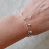 faceted Aquamarine sterling silver charm bracelet on model