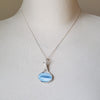 Blue Opal wire wrapped silver pendant on bust