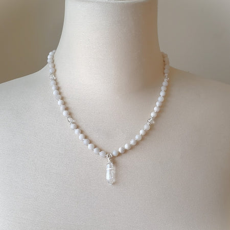 Silk knotted white crazy lace agate with crystal point on bust
