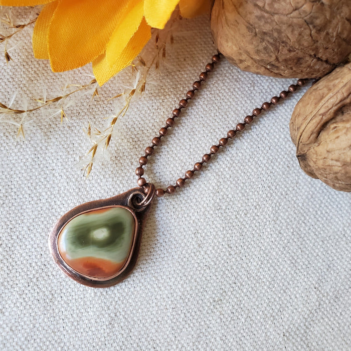 Freeform Imperial Jasper copper metalsmith pendant on linen