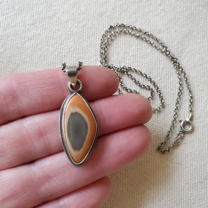 Freeform Imperial Jasper silversmith necklace in hand