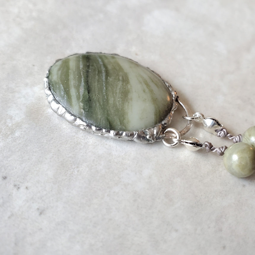 Detail of Serpentine focal stone set in soft solder technique