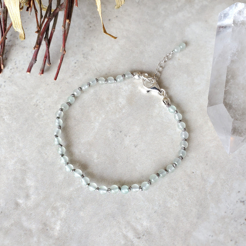 Green Aventurine knotted bracelet on tile