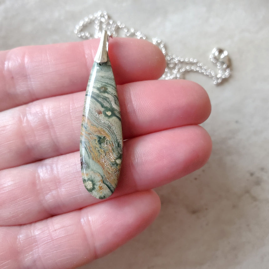 Ocean Jasper teardrop pendant necklace in hand