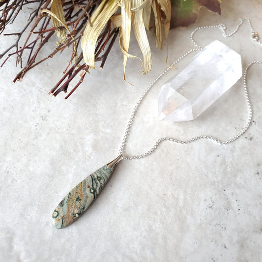 Ocean Jasper teardrop pendant necklace on tile