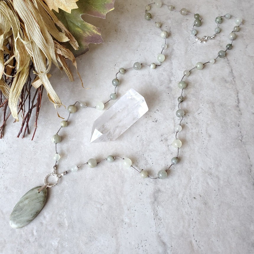 Beaded gemstone necklace with Serpentine focal on tile