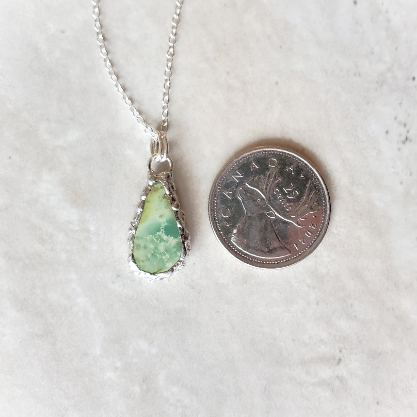 Variscite Soft Solder Pendant Necklace  beside a quarter
